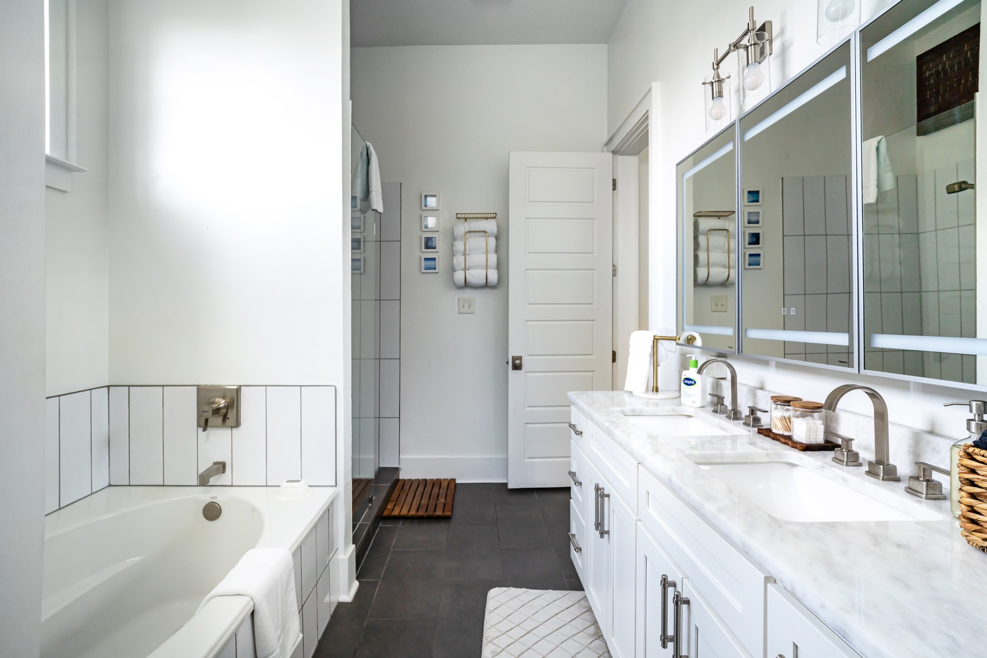 Primary bathroom with double vanity and soaking tub