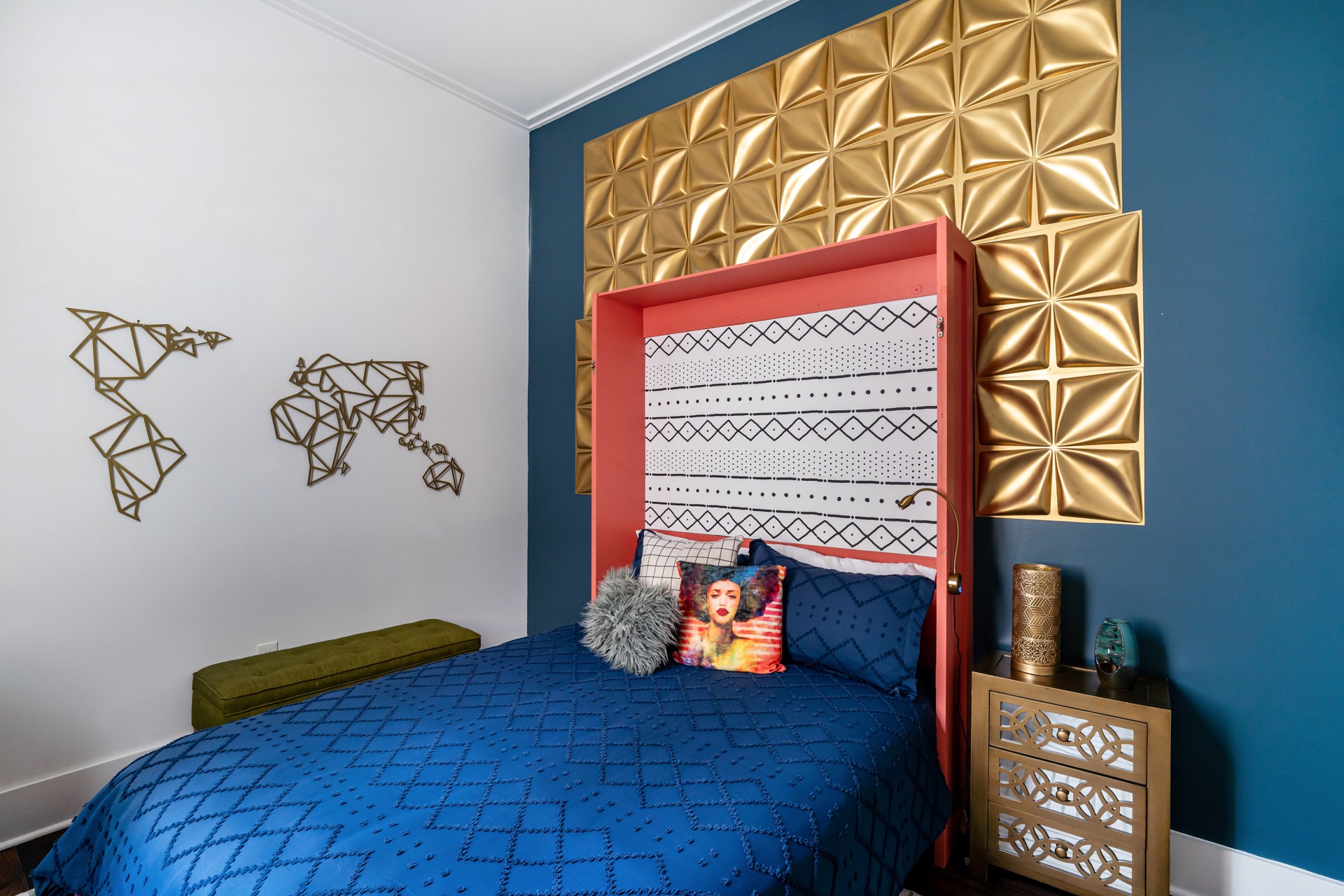 Blue bedroom with gold accent wall