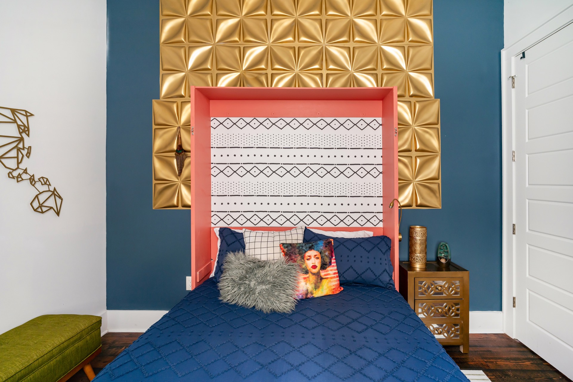 Blue bedroom with gold 3D wall panel headboard